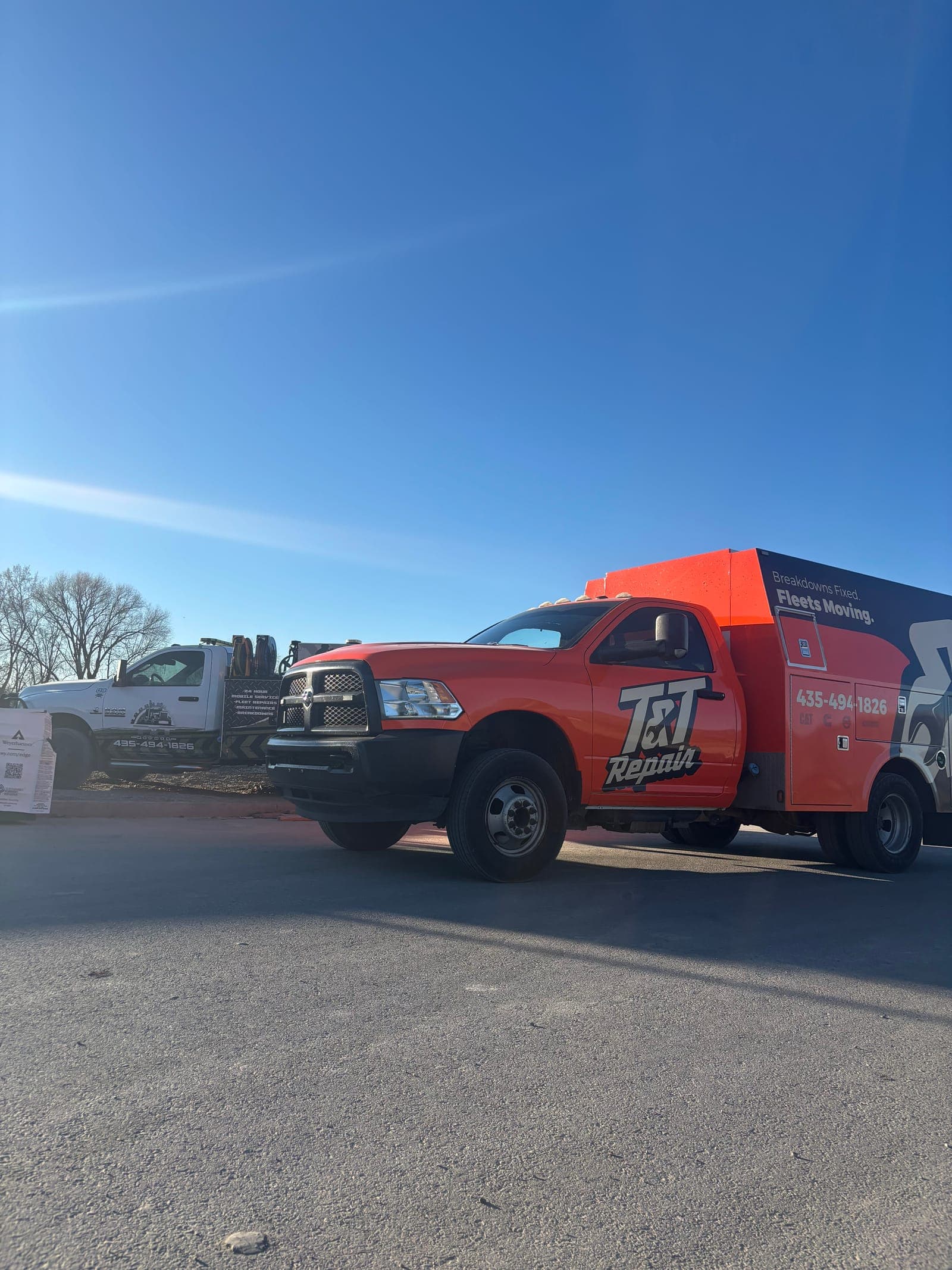 Two T&T Repair mobile service trucks